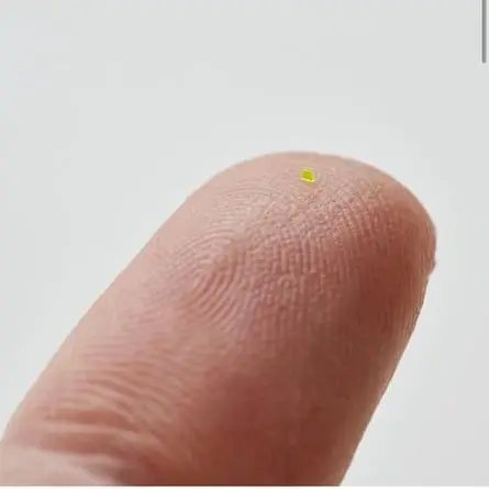 MSCHF’s Microscopic Handbag on a fingertip - it is less than 0.03in wide