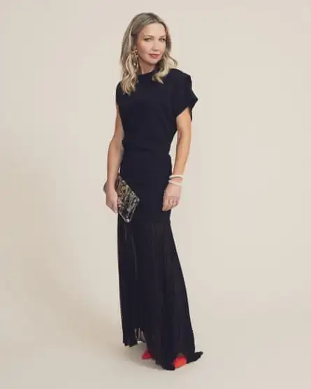 Jess Cartner-Morley in long black dress with clutch bag