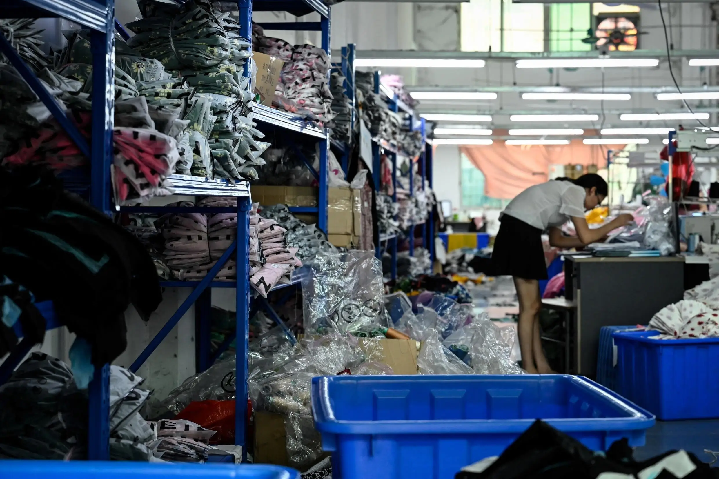 A worker makes clothes at a garment factory that supplies fast fashion e-commerce company Shein in Guangzhou, China, on July 18, 2022.