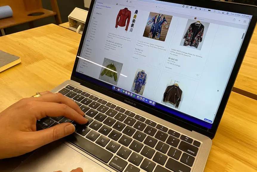 a computer screen with clothing items being sold online