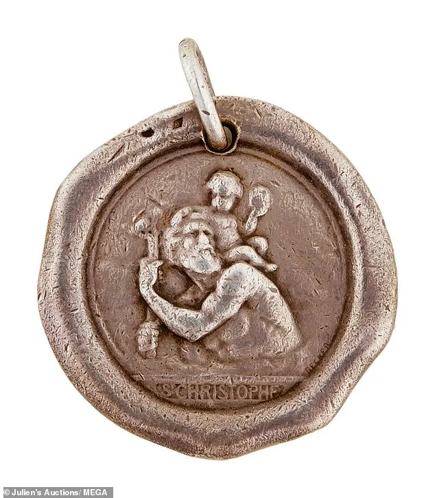 A Saint Christopher religious medal once owned by Monroe is among the items in the lot