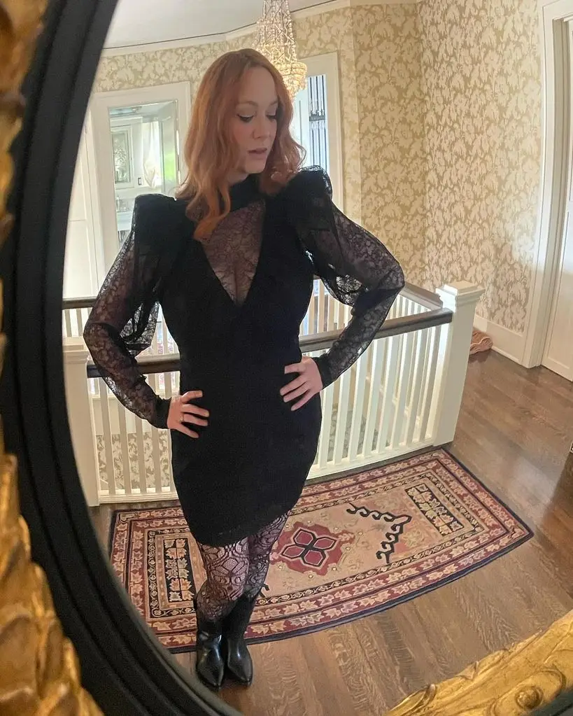 christina hendricks wearing black lace mini dress inside home