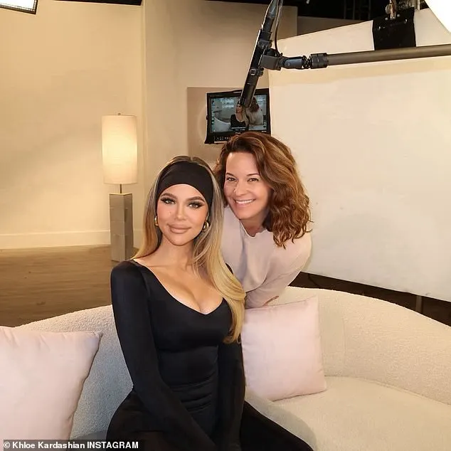 As she sits on a cream-colored sofa with a mattress as a speaker hands over her head in this new picture, Khloe also wears a small cut dark top with matching leggings. Behind her is a woman in a white top as a screen with Khloe's image can be seen in the background. The caption reads: 'Me and my Paxy PP.' She may work on the reality TV show for Hulu titled The Kardashians