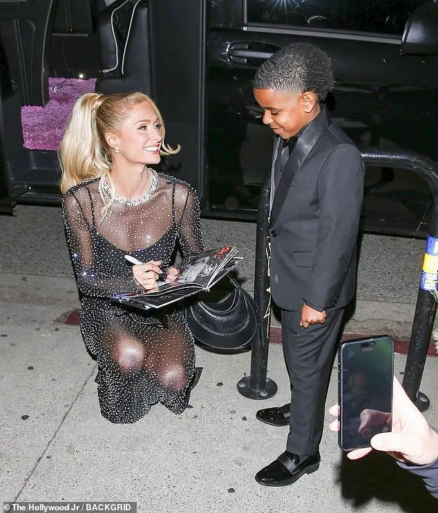 Paris signed autographs for fans outside the venue