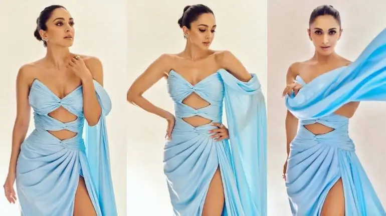 A draped blue blue cutout gown with a great slit was worn by Kaiara Advani lately. She paired her high- glam look with dewy makeup, winged eyeliner and neatly tied hair bun for a classic finish ( Image: @kiaraaliaadvani/Instagram )