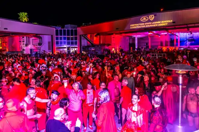 A sea of red takes over the dance floor at the LGBTQ Community Center of the Desert's Red Dress/Dress Red Party in Palm Springs, Calif., on March 16, 2024.