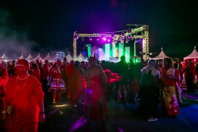 A sea of red takes over the Palm Springs Air Museum at the LGBTQ Community Center of the Desert's Red Dress/Dress Red Party in Palm Springs, Calif., on March 16, 2024.