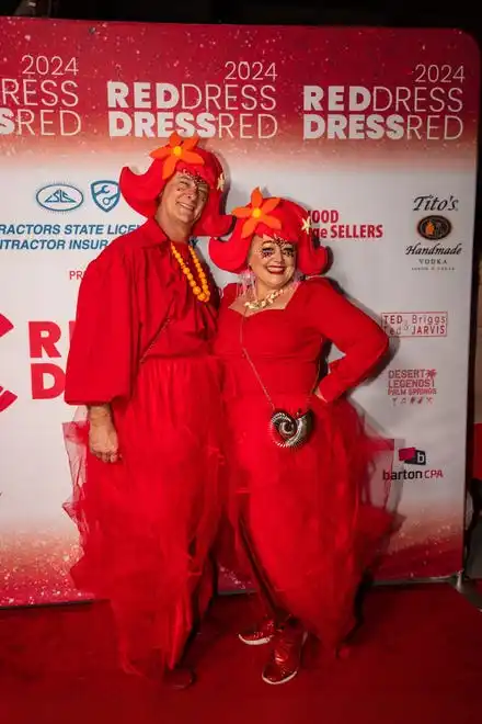 Jeff and Crystal Howe show off their red duds at the LGBTQ Community Center of the Desert's Red Dress/Dress Red Party in Palm Springs, Calif., on March 16, 2024.