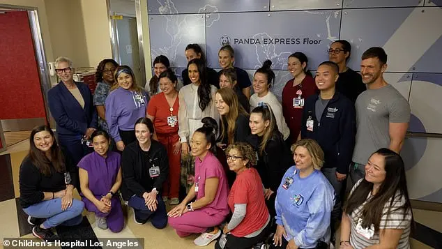 Meghan poses for a group photograph during her visit last month to the Children's Hospital Los Angeles