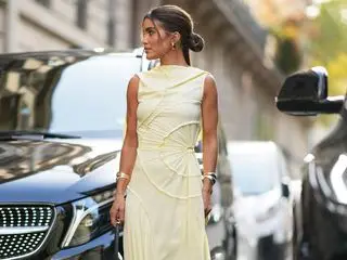 Street style star wearing yellow dress