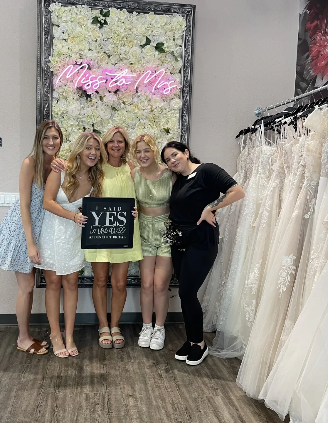 Tanner posing with family and Elizabeth Brown at Benedict Bridal after she said 'Yes' to the dress