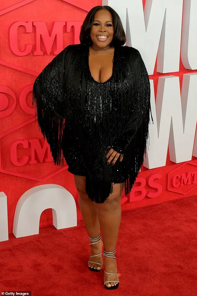 Amber Riley shimmered in a black dress with a fringe on Sunday while attending the 2024 CMT Music Awards in Austin, Texas