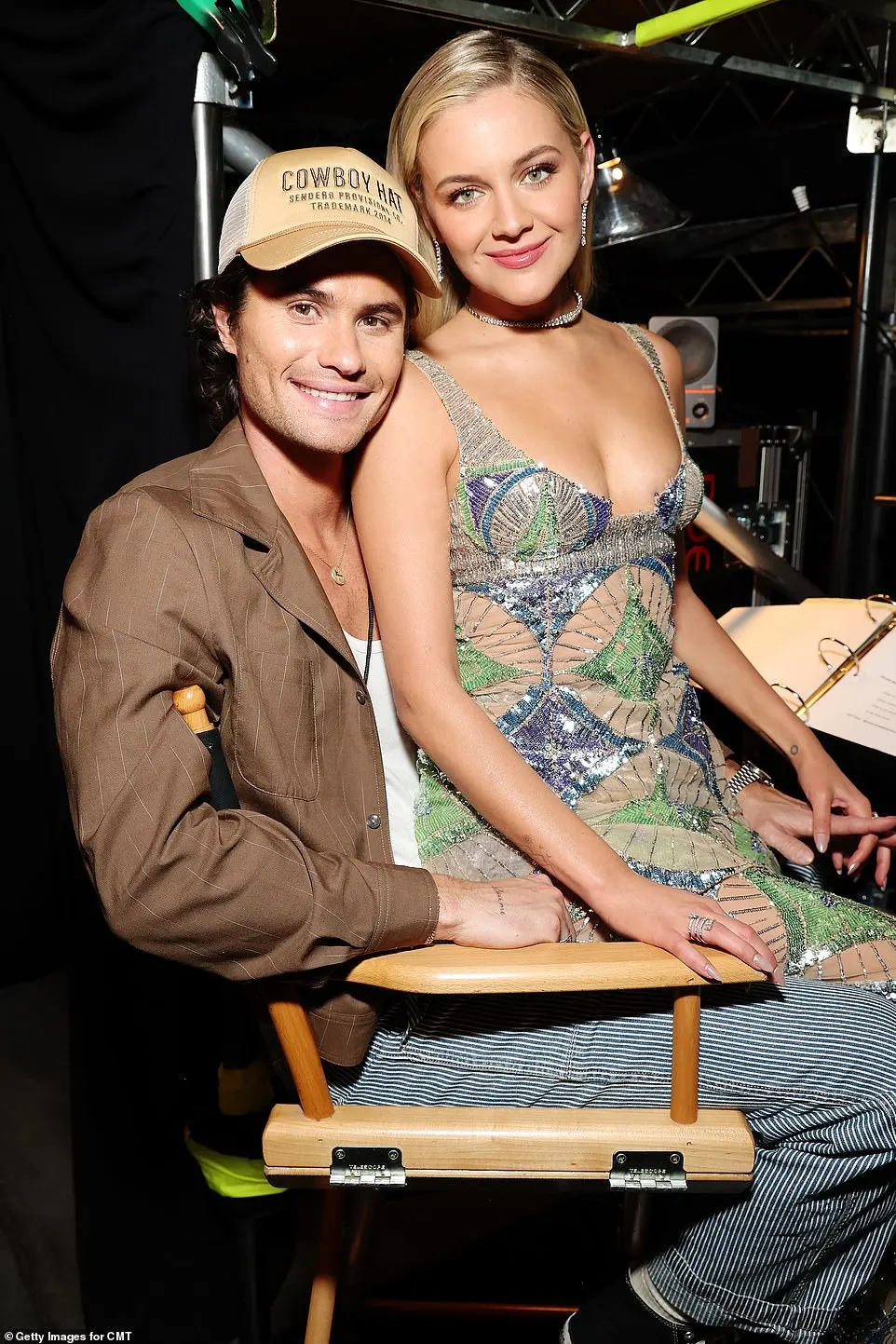 Ballerini was also seen affectionately sitting on her boyfriend's lap as they rested backstage during the lighthearted festivities