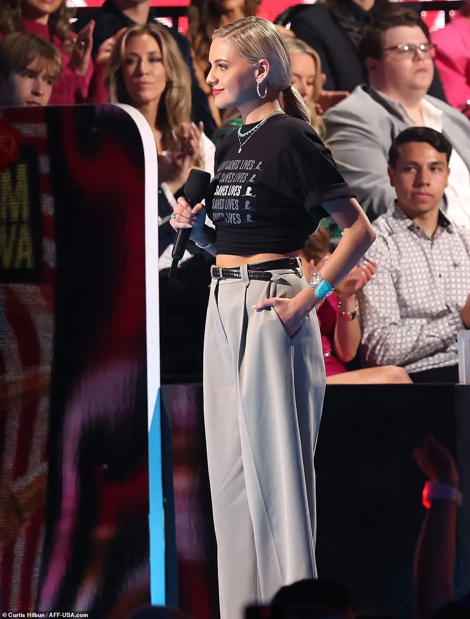 Ballerini decked out the look with turquoise necklaces as well as dazzling, silver-hooped earrings. Chunky bracelets were also placed on each of her wrists for a final touch