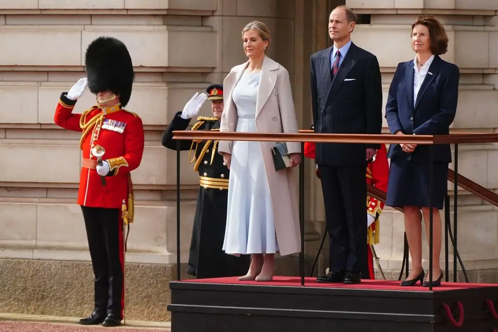 The Duke and Duchess of Edinburgh standing at Buckingham Palace for Changing of the Guard