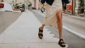 On the Italian Almalfi Coast, a young girl strolls through a constricting street in Positano.