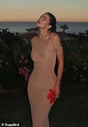 Jenner shows off a tan off-the-shoulder dress from    her  Khy collection