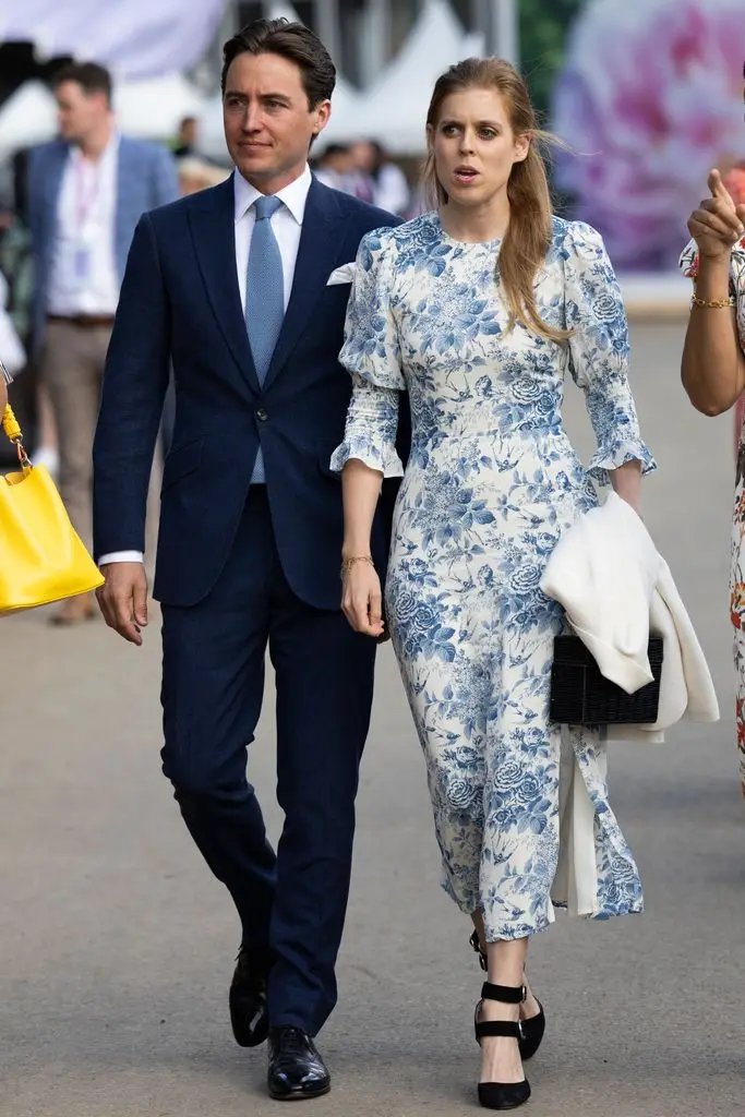 Princess Beatrice styled Reformation's Carolena dress with black heels and a matching bag and hair bow