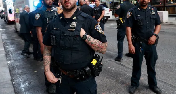 NYPD Midtown North Officers tries to block New York Daily News photographer from take pictures of EMS workers loading a injured worker to a ambulance outside building located at 550 Madison Avenue (formerly known as the Sony Tower, Sony Plaza, and AT&T Building) where a acetylene explosion early Wednesday, July 12, 2023 injured two workers on the 34th floor of the iconic tower. (Photo by: Luiz C. Ribeiro for NY Daily News)