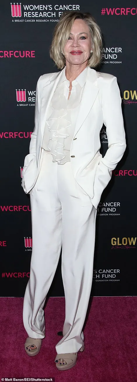 Lolita star Melanie, 66, looked sophisticated as ever in a white pantsuit with a matching silk shirt featuring a frilly collar