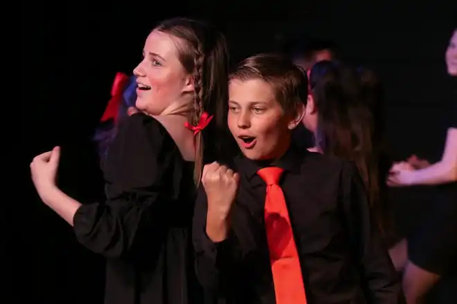 Mandolyn Binstead and Caleb Becak perform 