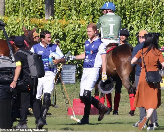 Harry is seen here following the match in Florida on Friday