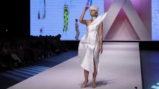 A model exhibits a creation she co-created with a designer at Dior and a number of other Serbian designers, based on Angelina Acimovic's drawings of dresses during a fashion week in Belgrade Serbia ( REUTERS ) in May. A model exhibits a creation she co-created with a designer at Dior and a number of other Serbian designers, based on Angelina Acimovic's drawings of dresses during a fashion week in Belgrade Serbia ( REUTERS ) in May.