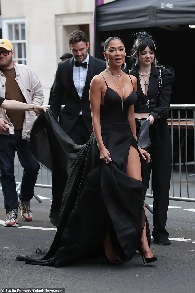 The former Pussycat Doll singer, who won Best Actress in a Musical for Sunset Boulevard , turned heads as she headed to the Royal Albert Hall