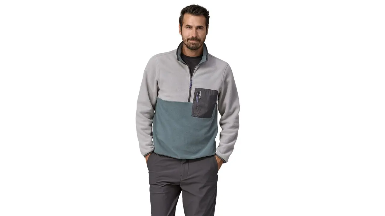 Man wearing Patagonia microdini fleece pullover in salt grey