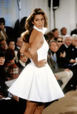 Cindy Crawford wears a white low back tennis dress on the Ralph Lauren runway in 1991