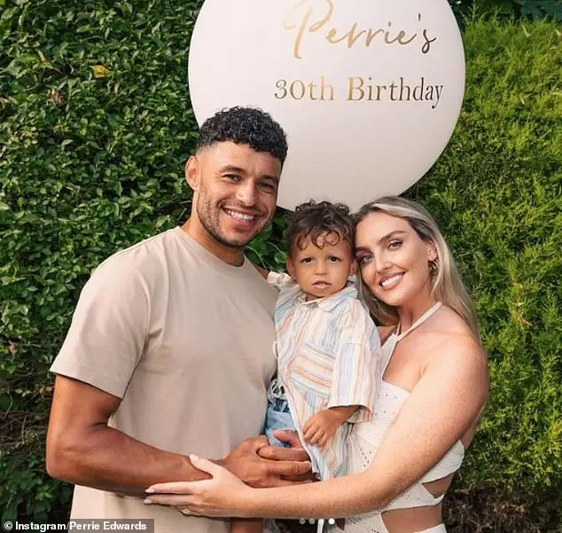 However her biggest fan is her son Axel, who Perrie explained already 'knows all the words' to all of her songs at just age two (pictured with her fiancé and Axel's father Alex Oxlade-Chamberlain)