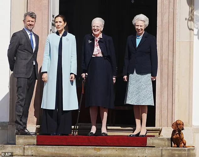 Queen Mary and King Frederik, Queen Margrethe and her sister, Princess Benedikte, posed outside Fredensborg Castle today alongside Margrethe's beloved sausage dog Tilia