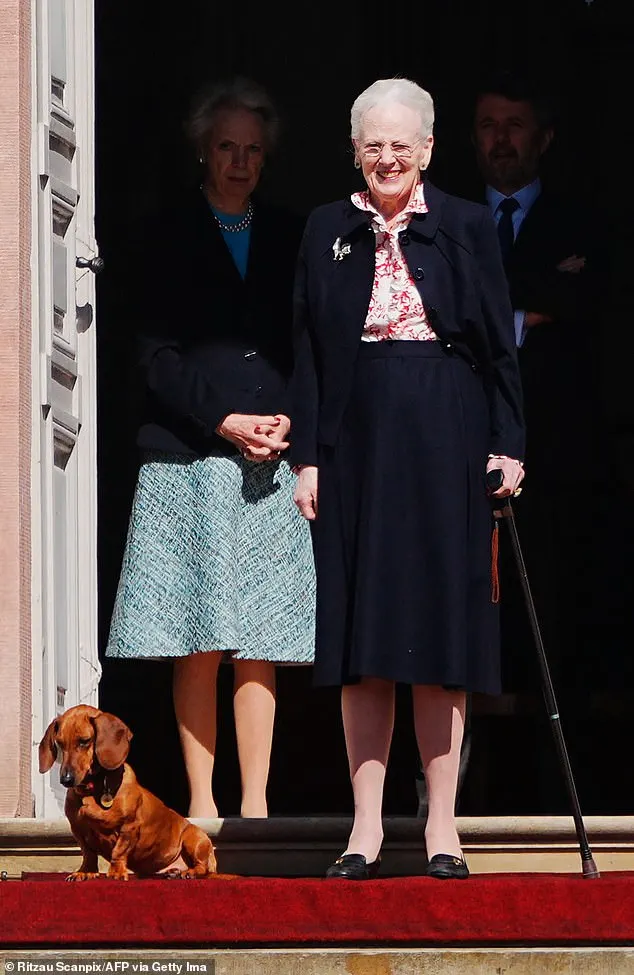 Queen Margrethe smiles alongside her beloved pup as she greets royal fans outside Fredensborg Castle ahead of festivities of her 84th birthday