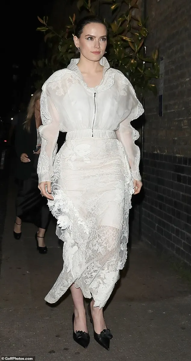 The actress, 32, cut a sophisticated figure as always in a pretty white lace dress as she made her arrival to the celebrity hot spot in central London