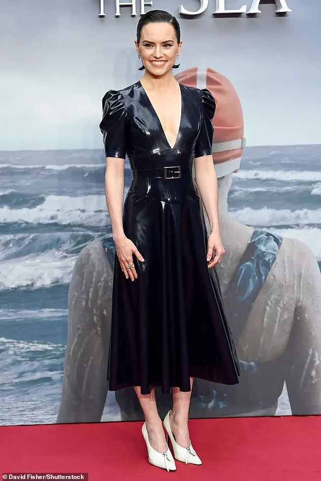 Earlier in the night she made sure to pose up a storm as she attended the glamorous screening event