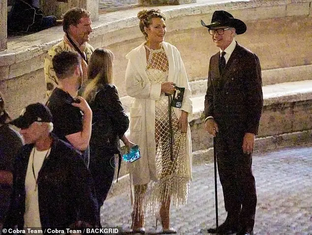 She seemingly talked to director Paul Feig during downtime on the set, with her hair being tossed up into a loose bun