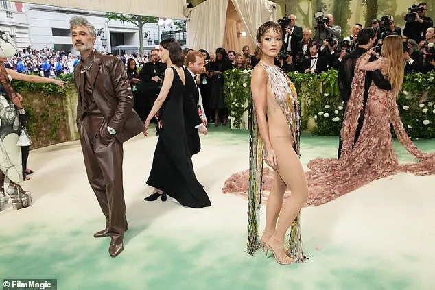 The songstress arrived at the event with her husband Taika Waititi, who was ever the gentleman as he helped sort her dress train on the red carpet