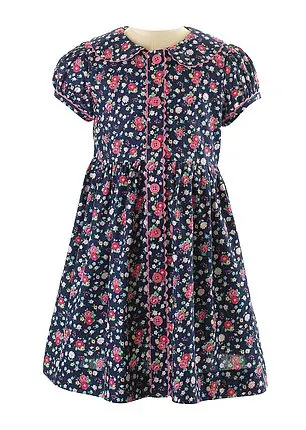 The charming dress is trimmed with pink ric-rac and buttons, complete with matching bloomers. The garment now costs £69