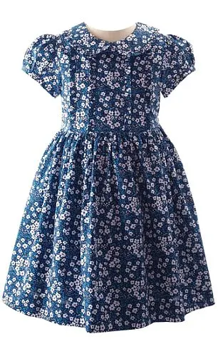 The dress is adorned with a ditsy floral print in shades of navy and white. The garment now costs £79