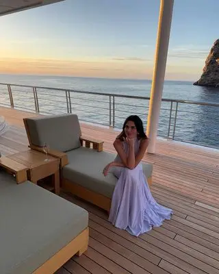 Jenner poses on the deck of yacht in mallorca wearing a sheer dress