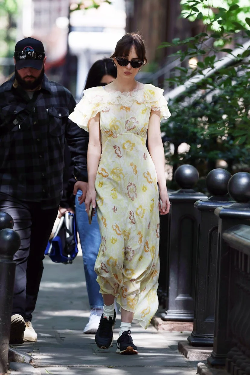 Dakota Johnson is seen arriving to the set of 'Materialists' in New York, New York wearing a yellow...