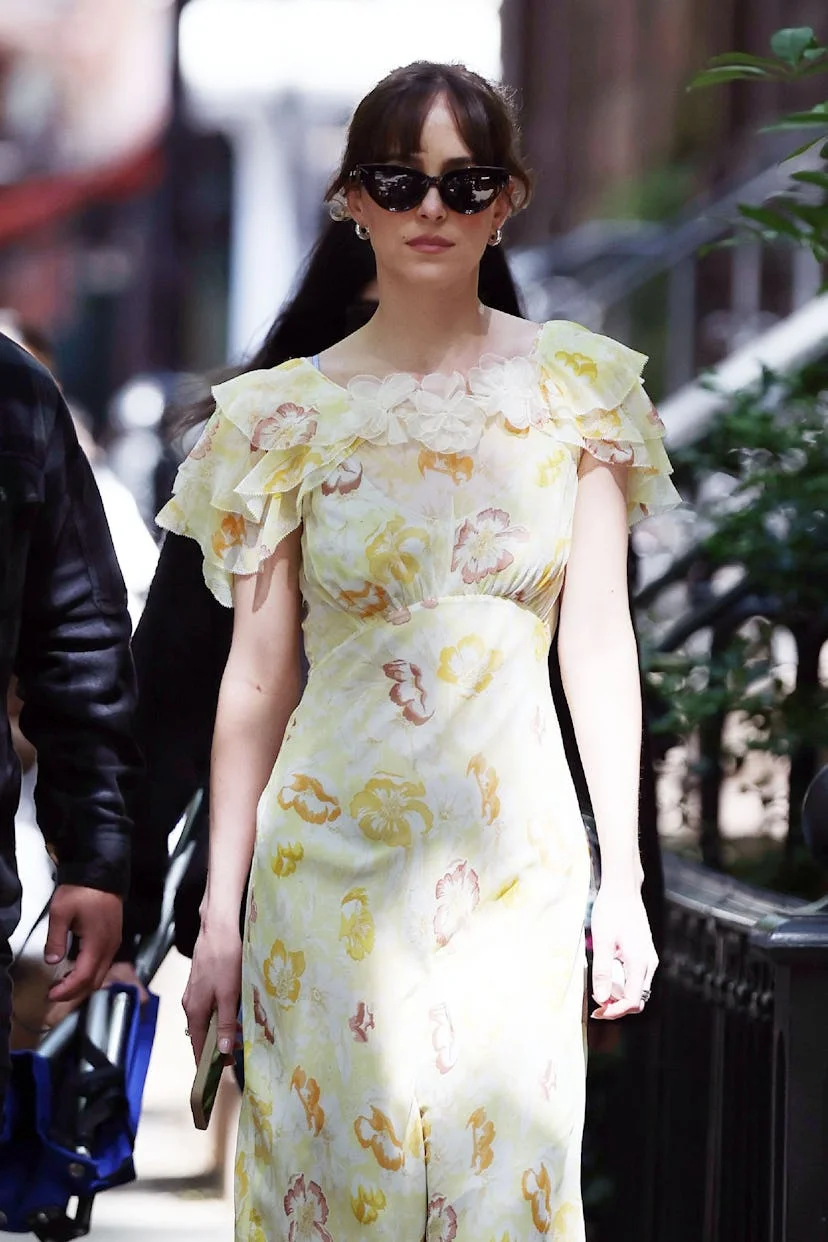 Dakota Johnson is seen arriving to the set of 'Materialists' in New York, New York wearing a yellow...