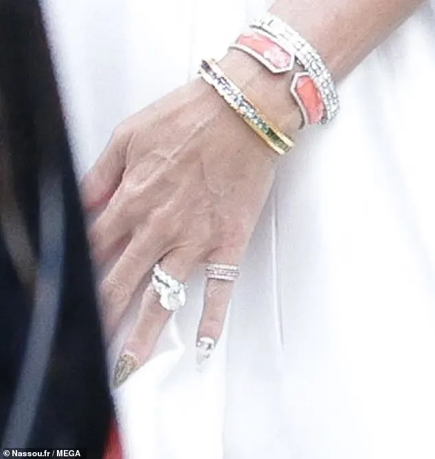 She was wearing what appeared to be a large diamond wedding band alongside her impressive engagement ring