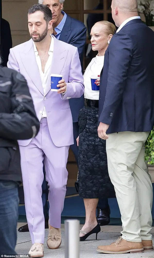 Paige's mom Nancy Walton Laurie, 73, was spotted amongst the crowd (seen behind Alexander), and she opted for a white long-sleeve top that she tucked into a black maxi skirt