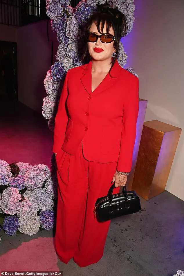 Cora Delaney looked effortlessly stylish in a red two piece suit