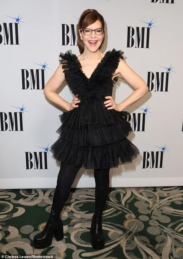 Stay singer-songwriter Lisa Loeb, 56, exuded edgy glam in a ruffled tulle LBD, opaque black tights and vinyl platform boots