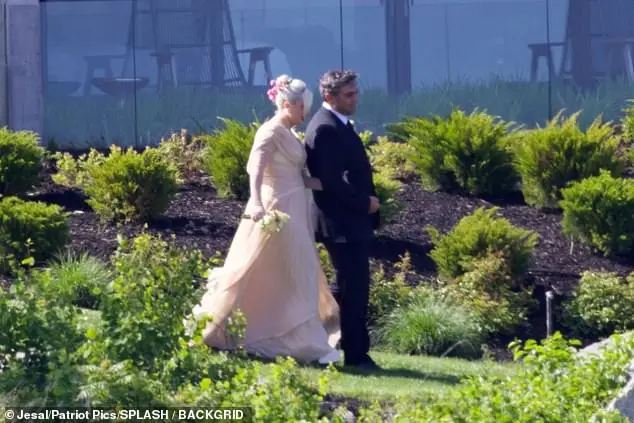 Gaga and Michael put on a loved-up display as they walked arm-in-arm around the picturesque venue