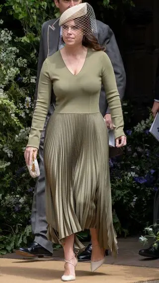 Princess Eugenie wearing a green dress walks out of Chester Cathedral after the wedding of The Duke of Westminster and Olivia Henson