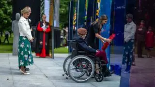 Prince Edward, Duke of Edinburgh and Sophie, Duchess of Edinburgh look on as 100-year-old Normandy veteran Jim Miller lays a wreath during a service of remembrance to commemorate the 80th anniversary of D-Day at the Normandy Memorial