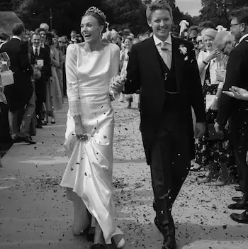 The Duke and Duchess of Westminster pictured as they are showered in what appears to be confetti